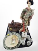 A Japanese porcelain sake set, figure of a Geisha, treen carvings, Wedgwood Jasperware plate, etc.