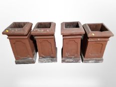 A set of four Victorian terracotta chimney caps,