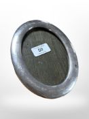 A silver oval photo frame,