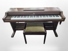 A Korg Concert 6000 digital piano and a piano stool