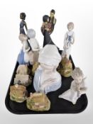 A Lladró bust of a lady, further Lladró figure of a cherub, several Lilliput Lane cottage ornaments,