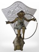 An Art Deco patinated metal and frosted glass figural table lamp, height 36cm.