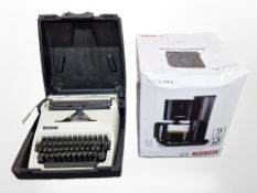 A Bosch coffee machine in box (continental plug), and an Adler typewriter.