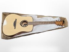 A Tramontane T66D acoustic guitar and a folding guitar stand.