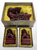 An oriental cast-resin figure group and a further pair of foo dogs.