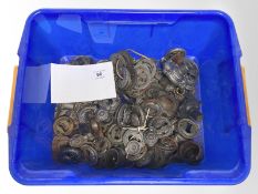 A quantity of vintage metal key escutcheons.