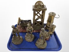 A group of brass mining figures and two miner's lamps, and a further figure of a bird.
