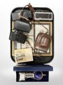 A group of vintage cameras, framed stamp montage,