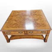 A reproduction yew wood coffee table,