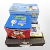 A travel cooler, a fan, and a car charging kit, all unused in original boxes.