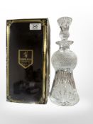 A Edinburgh Crystal decanter and stopper with etched thistles, height 29.5cm, boxed.
