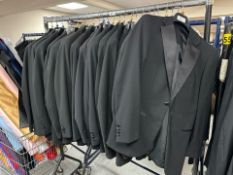 A rail of Gent's black tuxedo jackets,