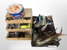 A quantity of fishing fly making equipment including various feathers,