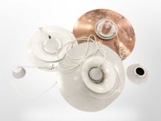 A group of late-20th century Scandinavian pendant light fittings.