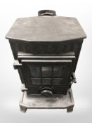 A cast-iron gas fire, height 53cm.