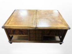 A contemporary mahogany storage coffee table,