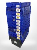 Twelve stackable plastic storage boxes with folding lids,
