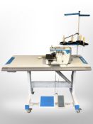 A Jack Industrial sewing machine in table