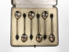 A set of six silver coffee spoons in Harrods box.