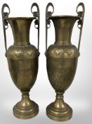 A pair of 19th century French brass twin handled urns,