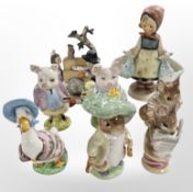 A group of Beswick Beatrix Potter figurines and two Goebel figurines.