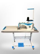 A Jack Industrial sewing machine in table