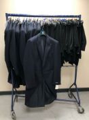 A rail of Gent's striped navy tailcoats and black tuxedo trousers, various sizes.