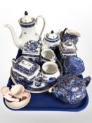A collection of Ringtons blue and white teapots, caddies, figural egg cup, etc.