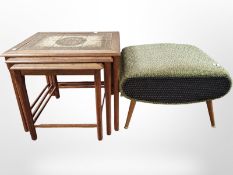 A nest of three teak tiled tables and a storage footstool containing spools of thread and other