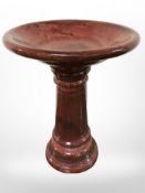 A glazed ceramic bird bath,