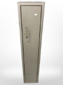 A metal gun cabinet (space for four guns) with four keys,