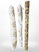 Three rolls of upholsterer's fabric / material, width approximately 140 cm, length unknown.