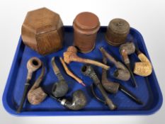 A group of pipes and tobacco jars