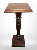 A reproduction mahogany pedestal with presentation plaque,