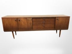 A 20th century teak low sideboard,