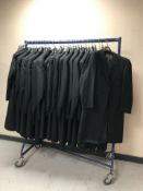A rail of Gent's black coats