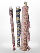 Three rolls of upholsterer's fabric / material, width approximately 140 cm, length unknown.