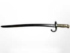 A French Remington bayonet with brass hilt, blade 50cm.