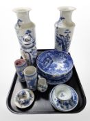 A pair of Chinese blue and white porcelain tapering vases depicting figures in a garden,