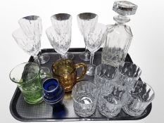 A crystal decanter, set of six wine glasses, set of five tumblers, silvered blue glass vase, etc.