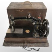 A Wheeler and Wilson cast-iron sewing machine, in box.