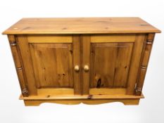 A contemporary pine double door low cabinet,