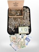 A large quantity of British and foreign coins, £1 and £5 bank notes, etc.