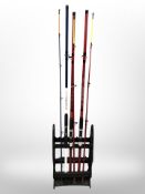 A fishing rod stand containing two Stiffi beachcaster 12-foot two-piece rods,