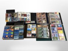 Eight albums containing a large quantity of telephone cards.