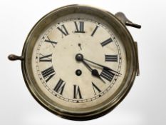 A brass circular ship's timepiece,