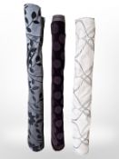 Three rolls of upholsterer's fabric / material, width approximately 140 cm, length unknown.