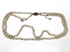 A good quality double strand of graduated pearls with 9ct yellow gold clasp mounted with split