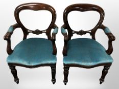 A pair of Victorian-style mahogany salon armchairs
