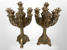 A pair of gilt ecclesiastical-style candelabra,